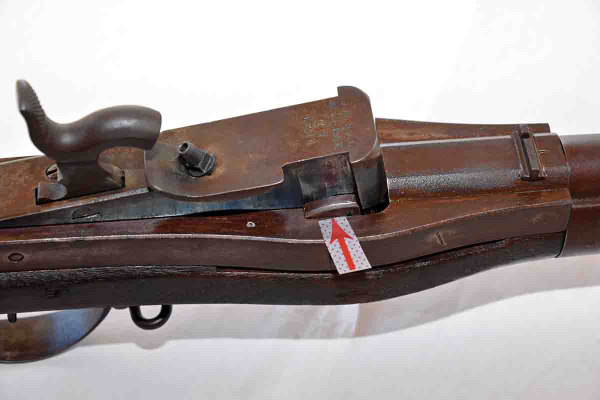 A different view of one of the two “chocks” that hold the breechblock forward. Note the lug on the breechblock just ahead of the chock. The chocks take the recoil from firing and transfer it into the sides of the receiver. Also note the offset rear sight.